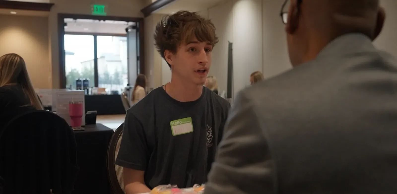 A student talks with an employer during a Draft Day interview.
