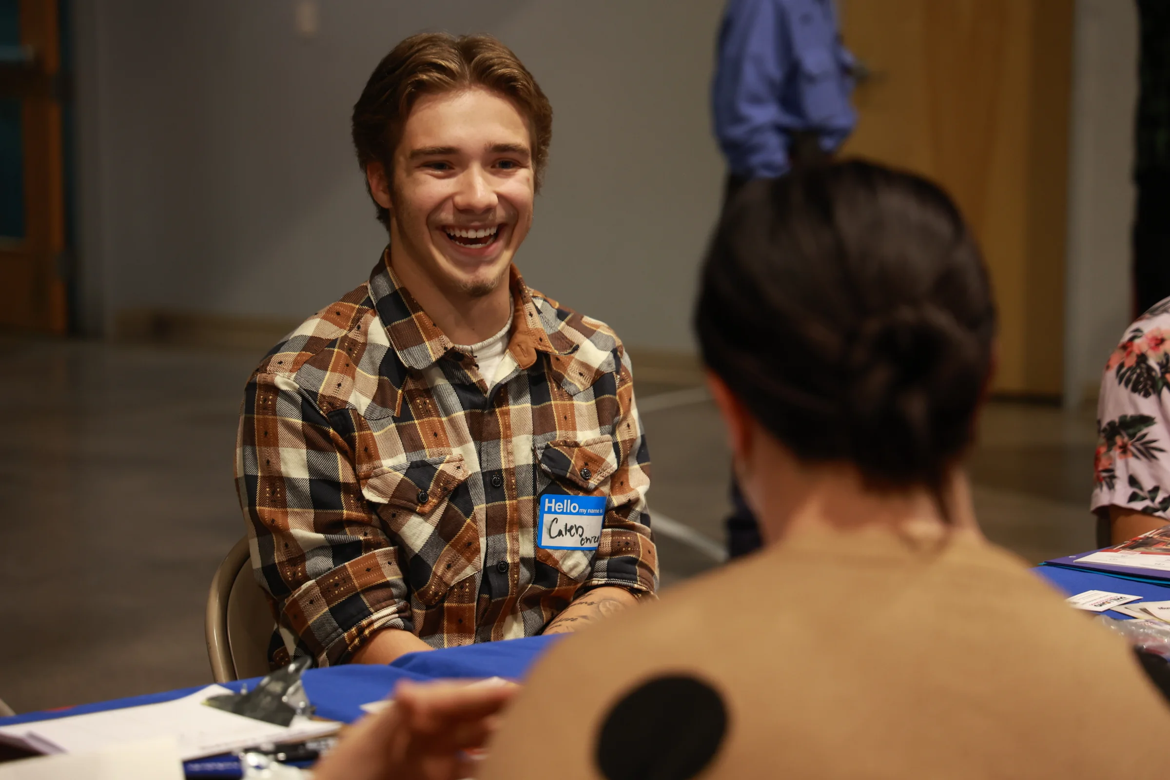 A student smiles during an interview with a local employer at Draft Day.